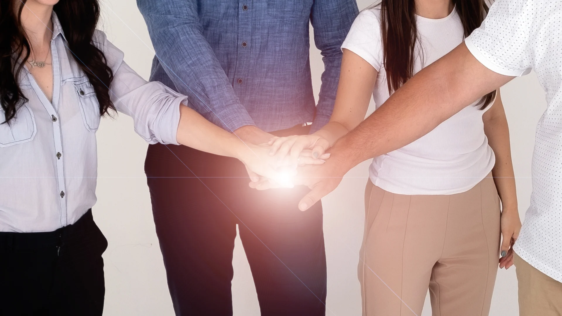 people stacking hands together